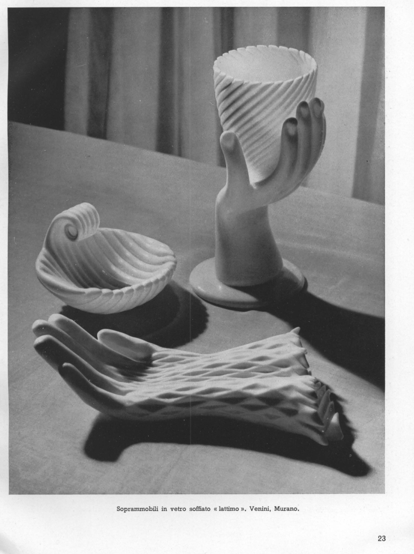 Blown glass ornaments, shell, hand holding bowl and hand sculpture in milk-white lattimo glass.